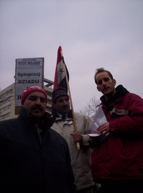 Al-Iraqi news journalist Bahjat, Jabbar and I with background slogan - 'Get the Fuck Out of Iraq Old Man' (Not intended to offend -Contains Polish pun)